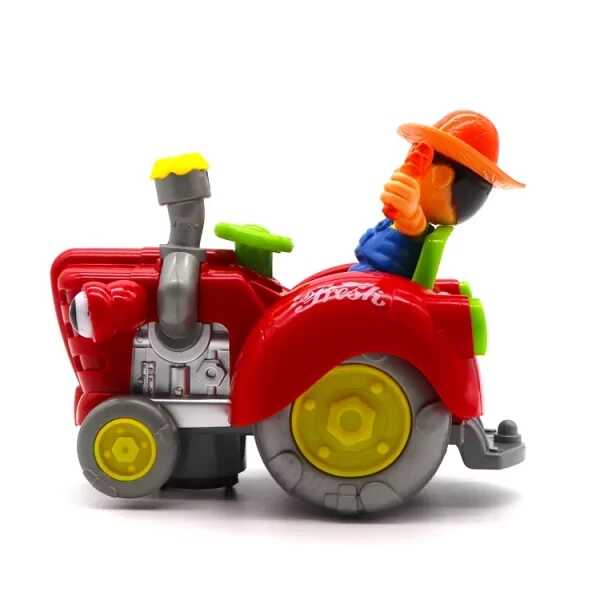 Zenélő és világító traktor kis figurával