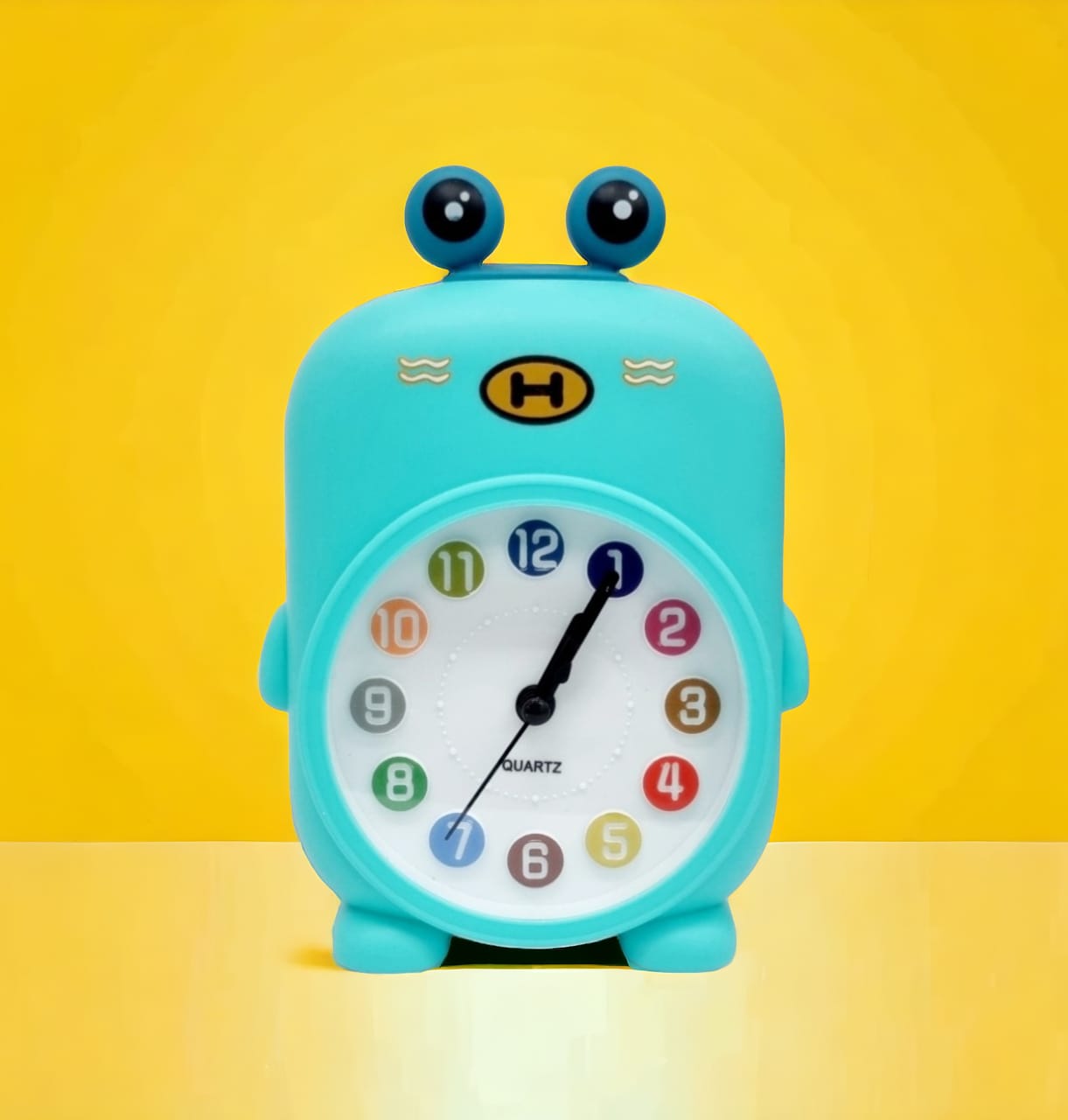 Béka formájú gyermek ébresztőóra színes számokkal türkiz kivitelben Torch